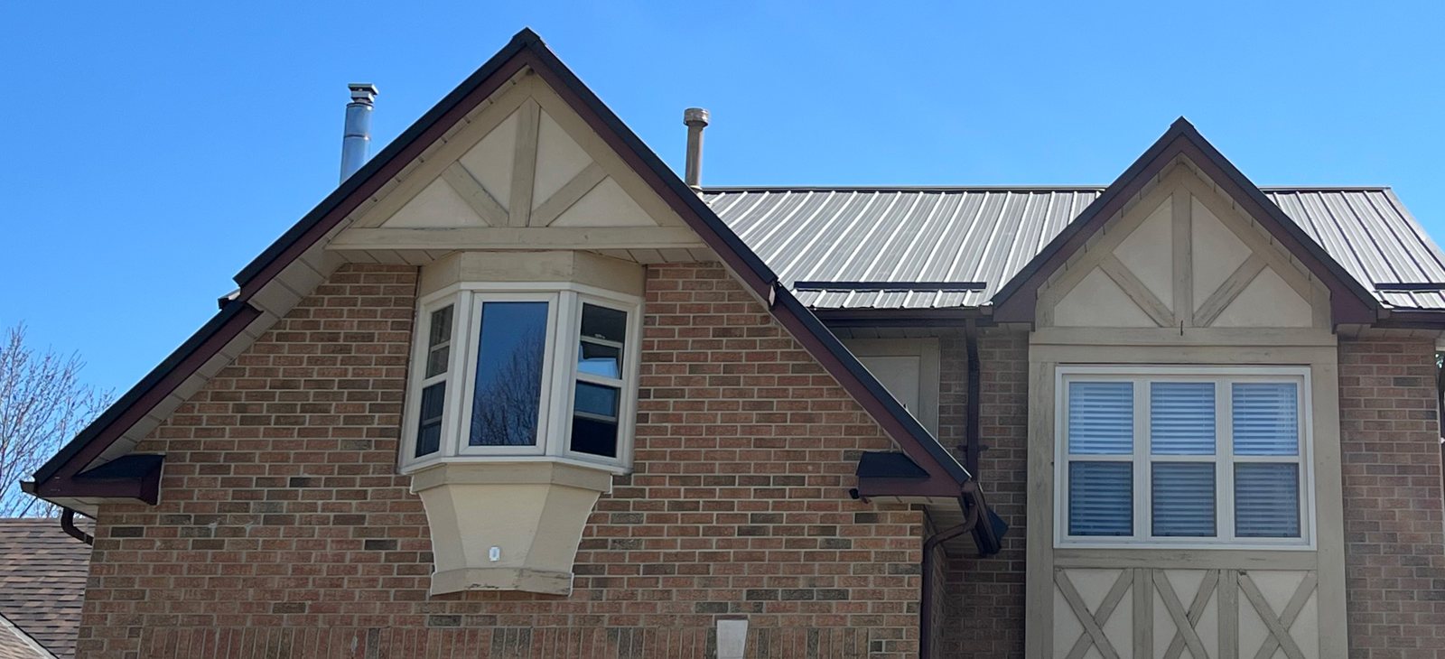 Steel roof on a brick tudor-style home
