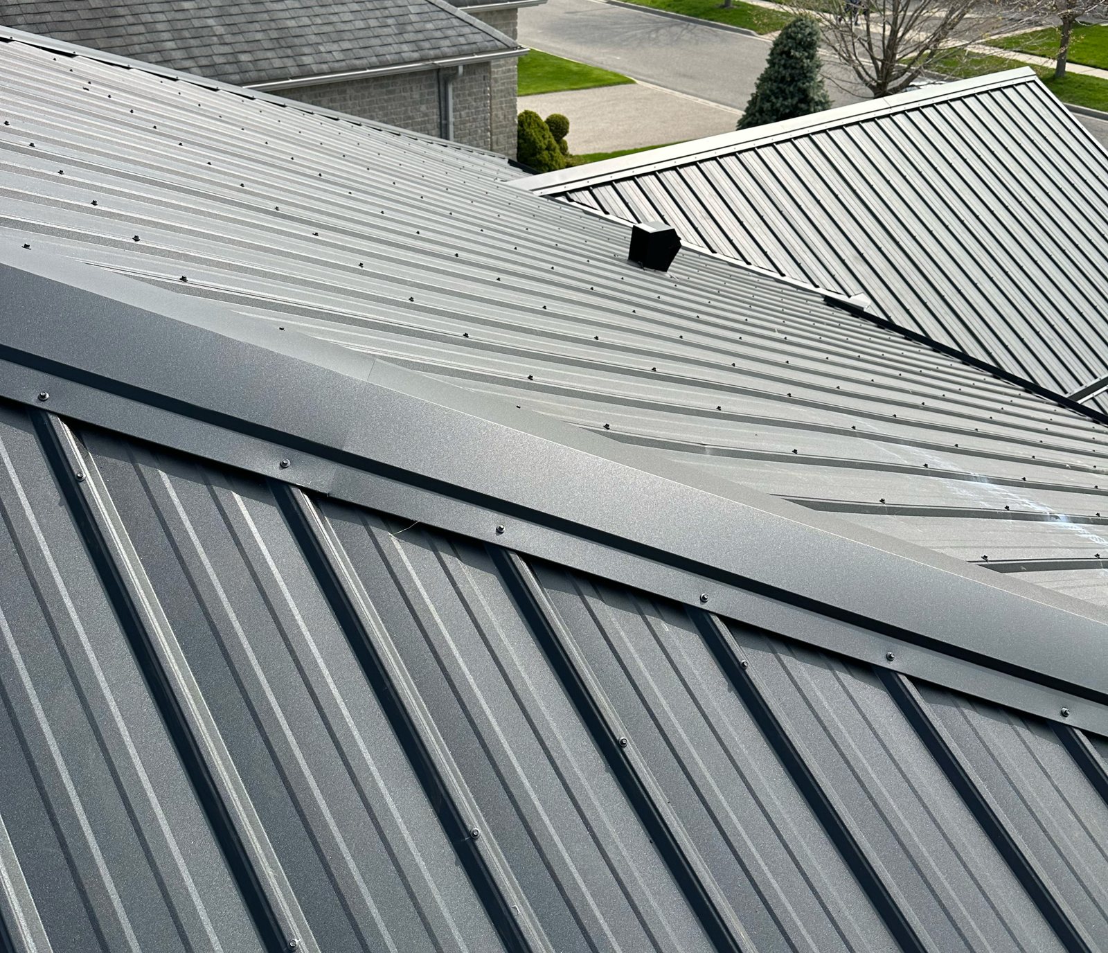 Close-up of standing seam panels and ridge