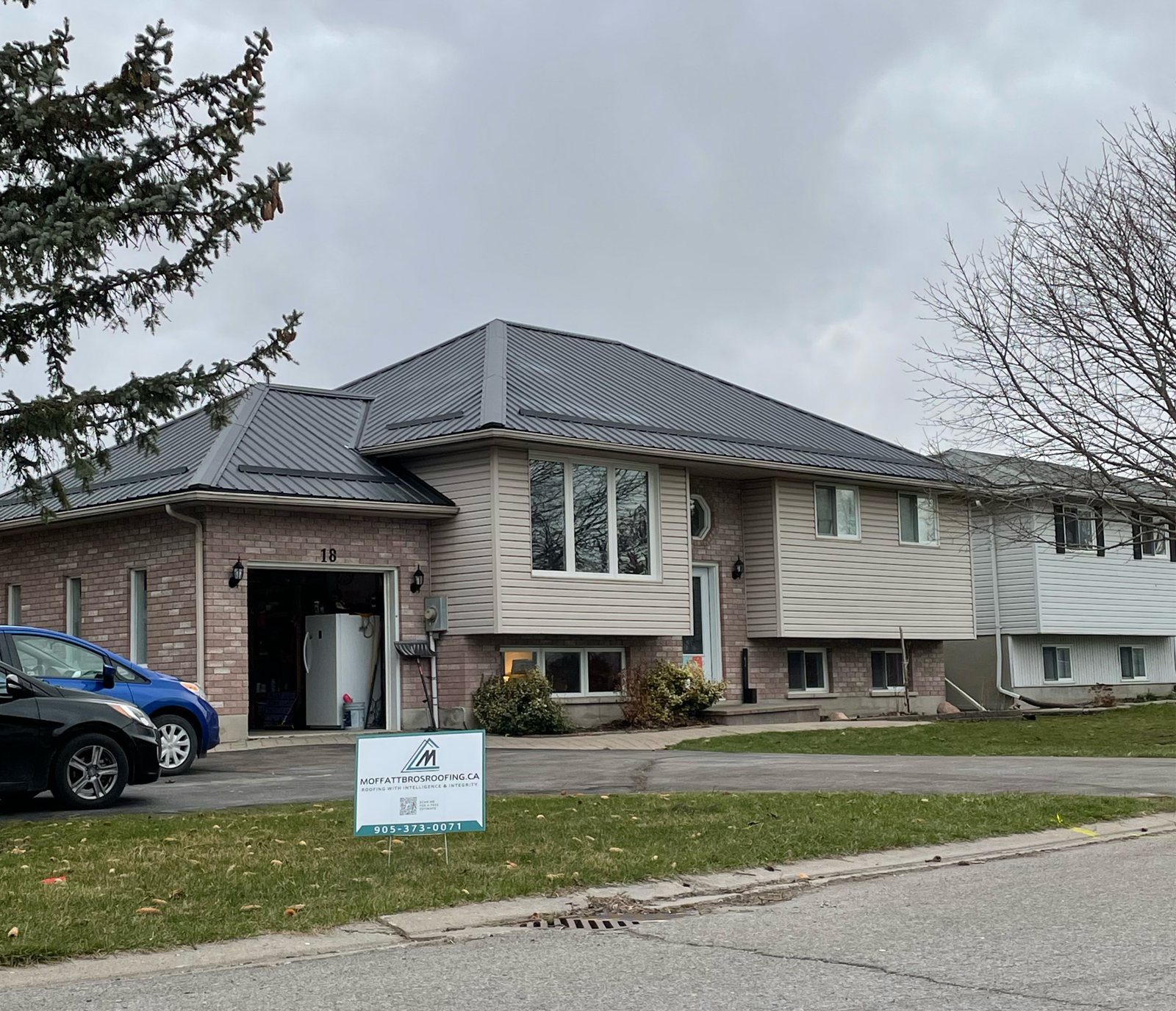Raised bungalow with grey steel roof