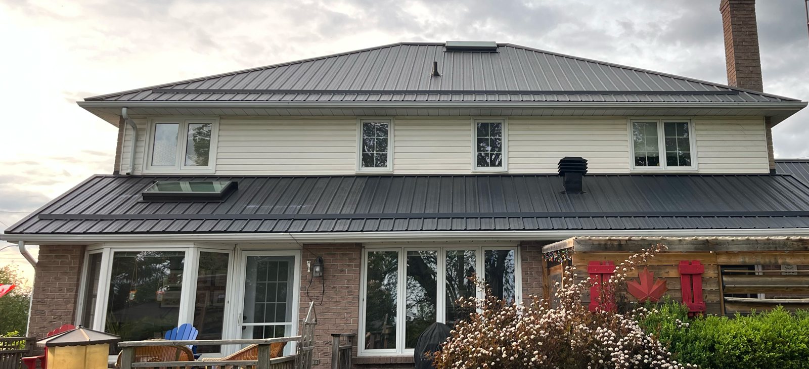 Wide steel roof on a large country home
